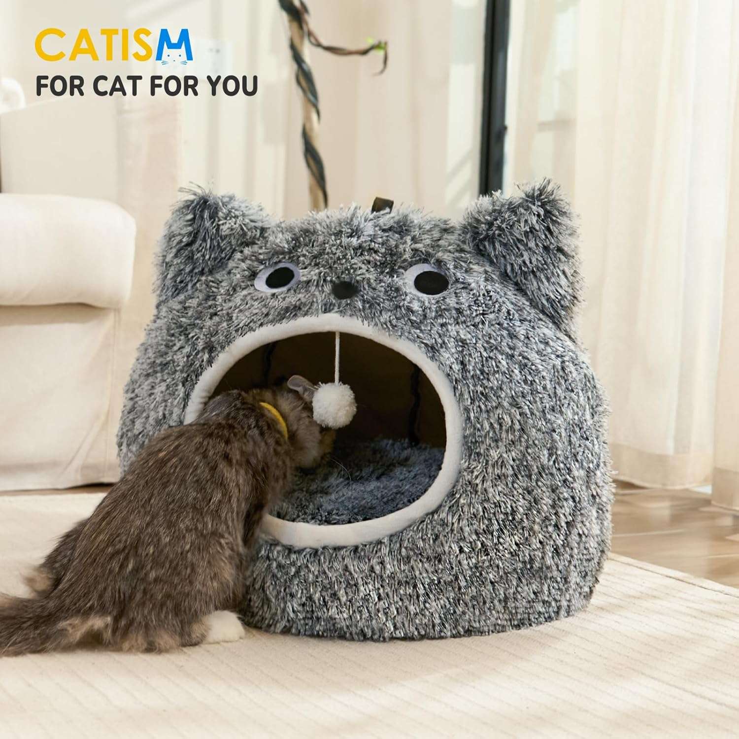 Cama tipo cueva semicerrada de felpa suave con cojin reversible y base antideslizante para gatos.
