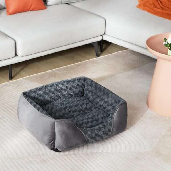 Cama ortopédica de perro suave color rosa con borde elevado y base antideslizante, perfecta para alivio de dolores articulares en mascotas grandes y pequeñas en Chile.