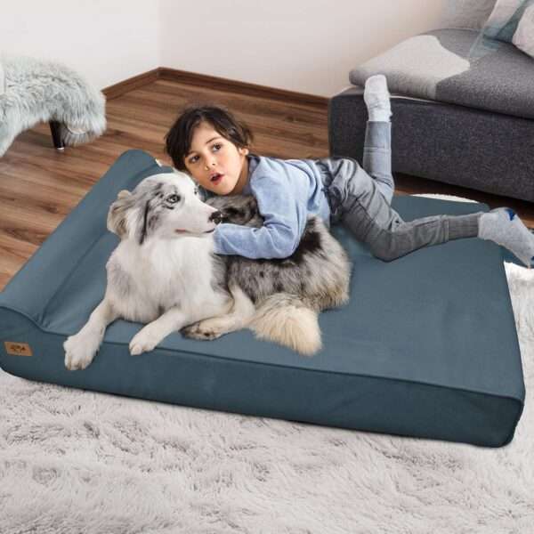 Cama sofá ortopédica XL para perro grande, 127×86 cm. Espuma de alta densidad, borde reforzado, entrada baja y forro impermeable.