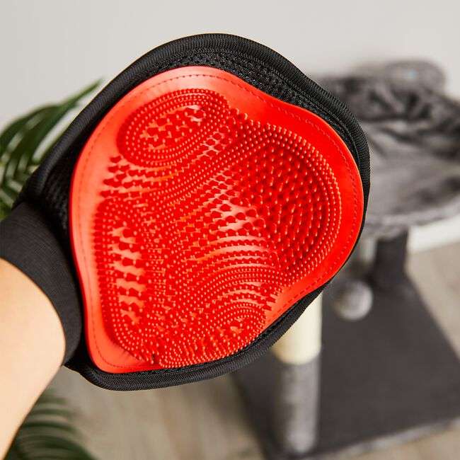 Guante masajeador y saca pelo de silicona para el aseo de perros y gatos.